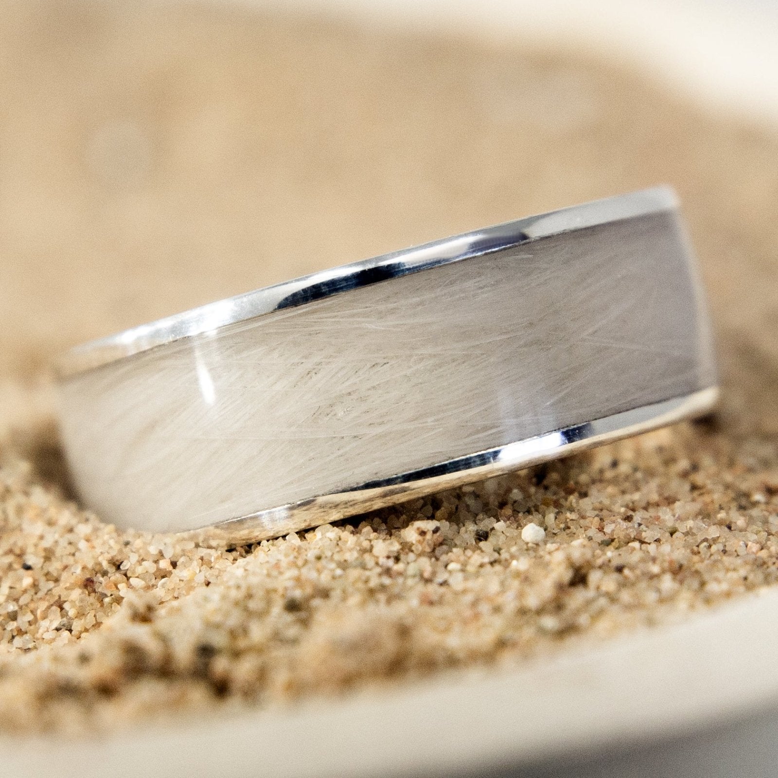 Sterling-silver pet-hair keepsake ring resting in pale fur
